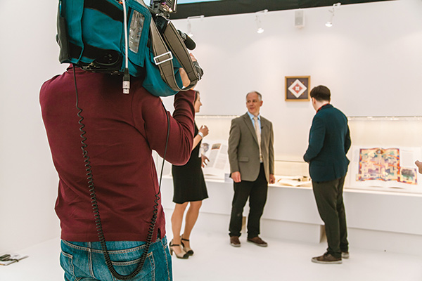 Tim giving an interview for Moscow TV news (with translator), in front of the display of his own and Donald Jackson’s work. 