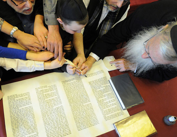 Woodcliff Lake temple's families share in the writing of the Torah