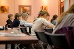 Kids studying pointed pen